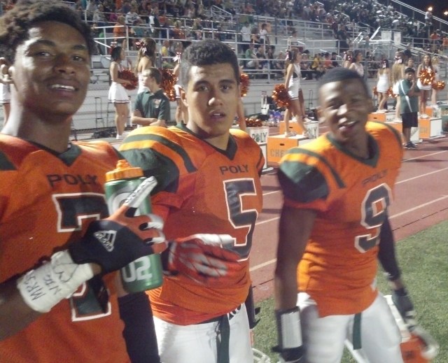 David Samuelu (center) ran for 87 yards and two TDs as Riverside Poly defeated Riverside Ramona, 45-14, on Friday, Sept. 6, 2013.