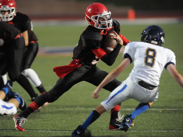 ACA's Bradley Mowbray (ball carrier) will be a marked man in the Ambassador League in 2014. / John Valenzuela for SBSUN.com