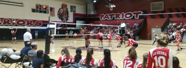 Jurupa Valley Patriot's Vanessa Arredondo (left) serves during the fourth game vs. Riverside La Sierra on Tuesday, Oct. 13, 2015. 