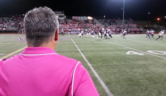 A look over the shoulder of Corona Centennial head coach Matt Logan during Huskies' 47-14 win over Riverside King in Week 6.
