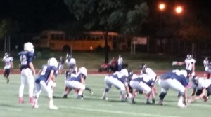 ABOVE: Riverside King QB Bradley Kleven (12) before a third-down play in the third quarter. BELOW: Kleven sets to throw as 7-foot, 400 lb. RT John Krahn pushed the pocket.