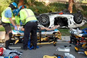 Desiree Esparza is treated by paramedics following a traffic accident on May 5, 2014. / Photos by JERRY SOIFER
